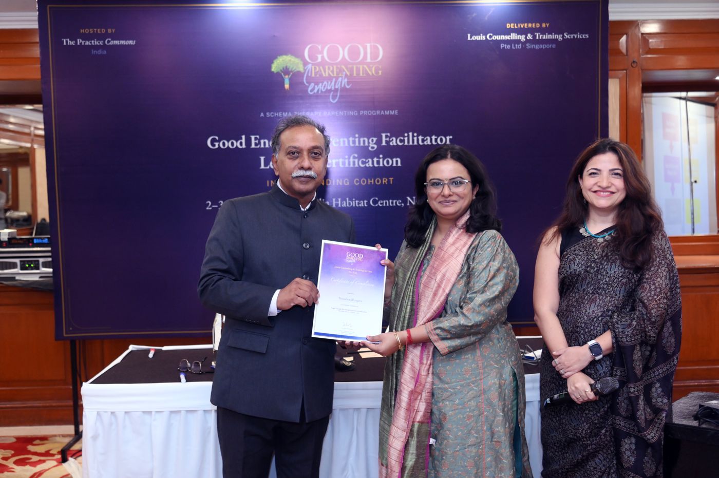 A participant receiving her Level 1 certificate from Dr. John Philip Louis, with Dr. Nitasha Borah
